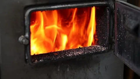 Stoker hand opens and closes the fuel boiler door. Stock Footage 233161967