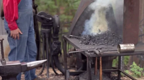 Stoking the fire Stock Footage 7767640