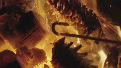Stoking the fire Video stock 231358456
