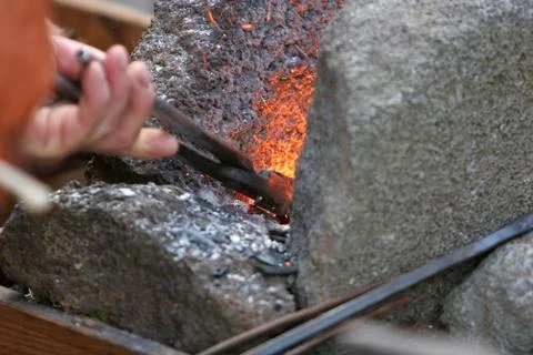 Stoking the fire Stock Photos