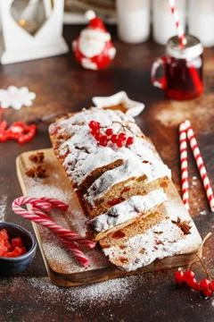 Stollen is a fruit bread of nuts, spices, and dried or candied fruit, coated  Stock Photos