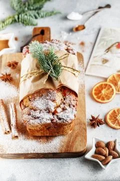 Stollen is a fruit bread of nuts, spices, and dried or candied fruit, coated  Stock Photos