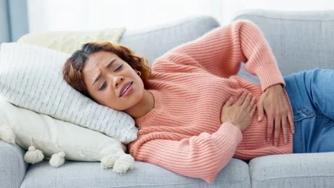 Stomach pain in early pregnancy stage include nausea and period cramps in need Stock Footage