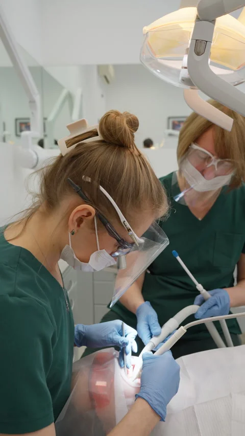 Stomatologist performs professional tartar removal with ultrasound instrument Stock Footage 332229272