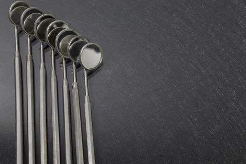 Stomotological instruments: Angled Mirrors on gray background Stock Photos