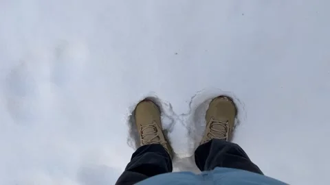 Stomping in Beige Winter Boots on Puffy Snow Stock Footage 322086587