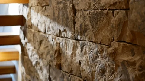 StoNatural stone brick wall interior of stair well in home. Video stock 98013716