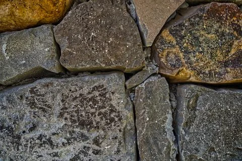 Stone and brick wall with various textures Stock-Fotos