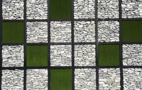 Stone and grass wall pattern texture Stock Photos