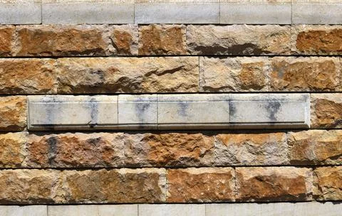 Stone and marble blocks in the structure of the wall Stock Photos