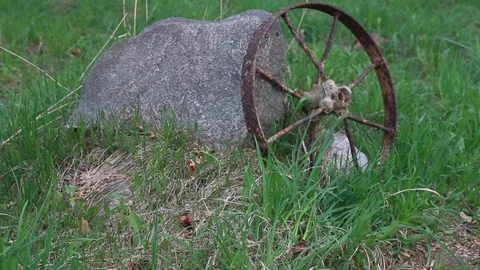 Stone and  old wheel Stock Footage 73804631