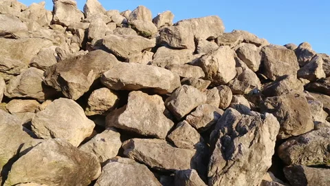 Stone and rock - hill or mountain in a desert under clear blue sky Stock Footage 167675751