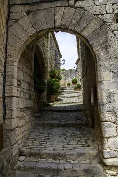 Stone Arch and Cobblestone Steps in a Narrow Medieval Village Alleyway With.. Stock Photos