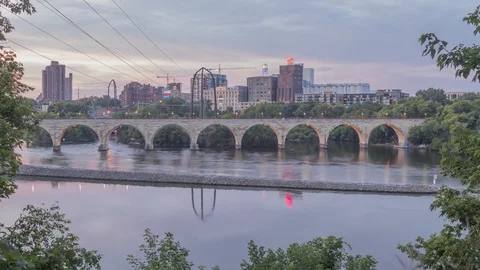 The Stone Arch Bridge and St. Anthony Main Skyline Sunset Timelapse Stock Footage 96087880