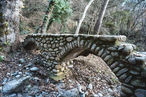 Stone arch bridge in a forest landscape near Meteora Greece Stock Photos