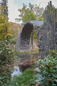 Stone arch bridge Kromlau, called Rakotz Bridge, view from the side Stock Photos