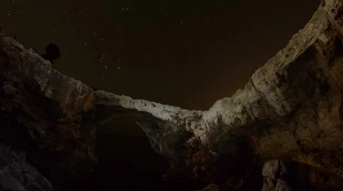 Stone arch lit up above the ocean at night to dawn time lapse, Majorca, Spain Stock Footage 42787653