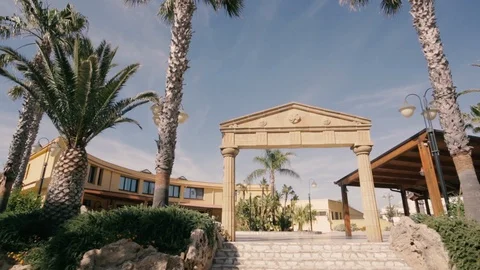Stone arch with palm trees Stock Footage 86487341