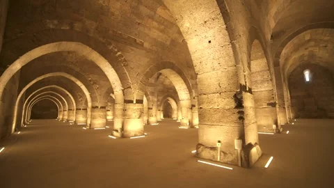 Stone arches and columns line Sultanhani Caravanserai - Monument Interior Stock Footage 340524688