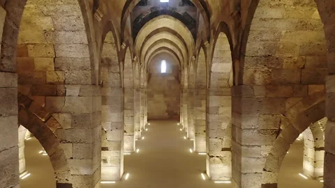 Stone arches and columns line Sultanhani Caravanserai - Islamic Architecture Stock Footage 340524760