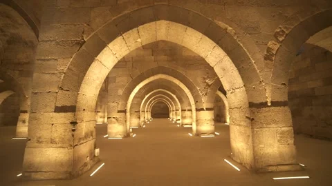 Stone arches and columns line Sultanhani Caravanserai - Medieval Building Stock Footage 340584448