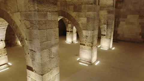 Stone arches and columns line Sultanhani Caravanserai - Heritage Interior Stock Footage 340584631