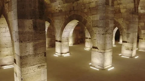 Stone arches and columns line Sultanhani Caravanserai - Vaulted Corridor Stock Footage 340584879