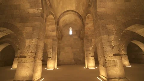 Stone arches and columns line Sultanhani Caravanserai - Vaulted Interior Stock Footage 340608554
