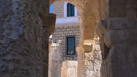 Stone Arches Framing Historic Window in Lecce Italy Stock Footage 345928094