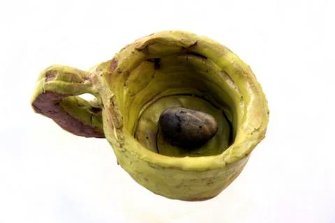 A stone in an art Cup Stock Photos