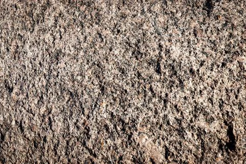 Stone background. Brown rough solid rocky material. Natural porous surface Foto stock
