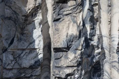 Stone background closeup texture. Focus on the pattern of the surface. Stock Photos