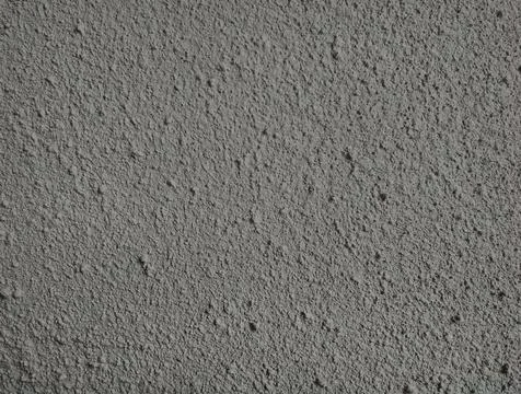 Stone background, embossed gray cement wall. Stock Photos