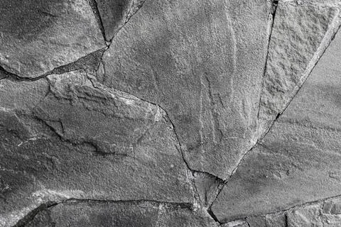 Stone background hard weathered base gray toned cracked line base monochrome Stock Photos