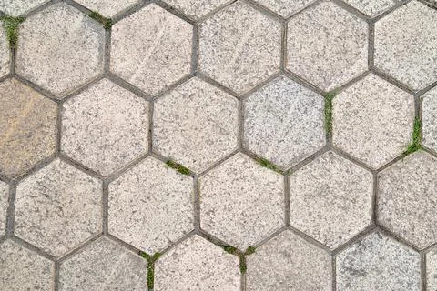 Stone background made of hexagonal slabs, background in the form of honeyco.. Stock Photos