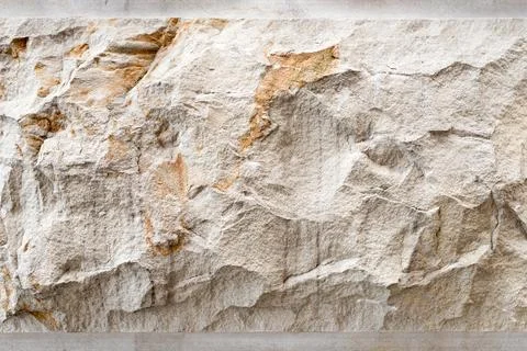 Stone background, sand wall pattern texture. Yellow natural stone facade, wal Stock Photos