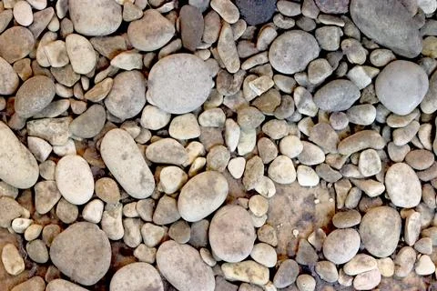 Stone background texture, rounded beautiful stones lie on the floor, beach. 스톡 사진