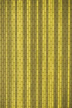 Stone background yellow vertical lines light and dark base Stock Photos