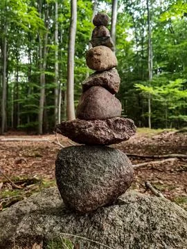 Stone balance in the forest in summer Stock Photos