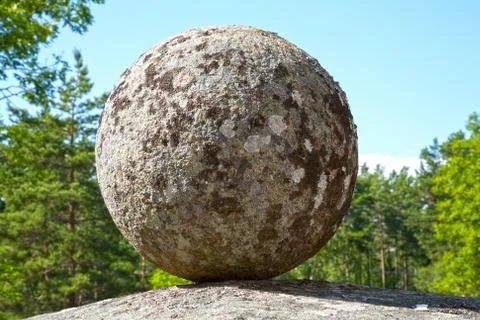 Stone ball on the rock Stock Photos