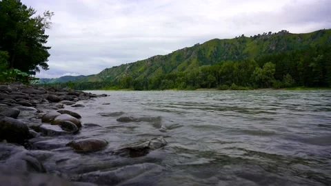 Stone bank of a mountain river Stock Footage 204564415