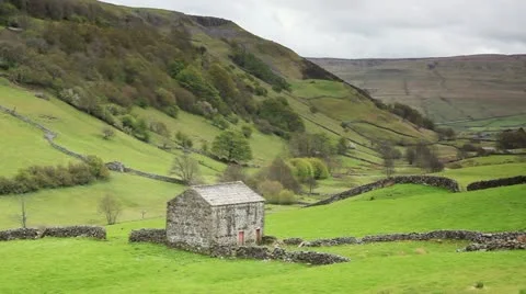 A stone barn in Swaledale which is in the Yorkshire Dales Stock Footage 11297210