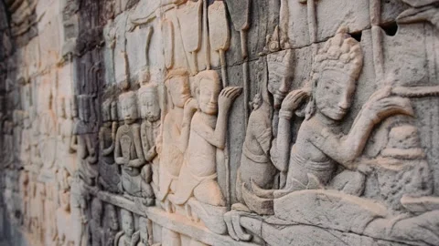 Stone bas relief at the bayon temple in cambodia showcasing scenes of khmer army Stock Footage 325071369