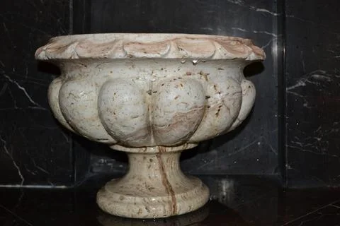 Stone basin in a sauna in the old classical style on a black background Stock-Fotos
