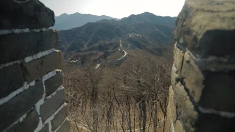 Stone Battlements Framing Mountain View Along Great Wall at Mutianyu, Beijing Stock Footage 345823938