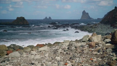 Stone beach and cliffs of the Atlantic Ocean. Tenerife Islands. Stock Footage 127855488