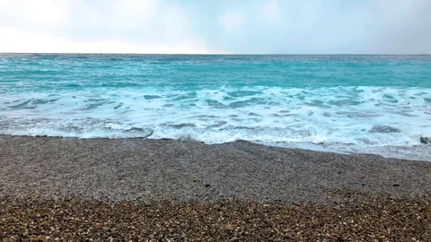 Stone beach with blue waves Video stock 86922061