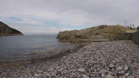 Stone beach on island in the fall on cloudy day Stock Footage 82940109