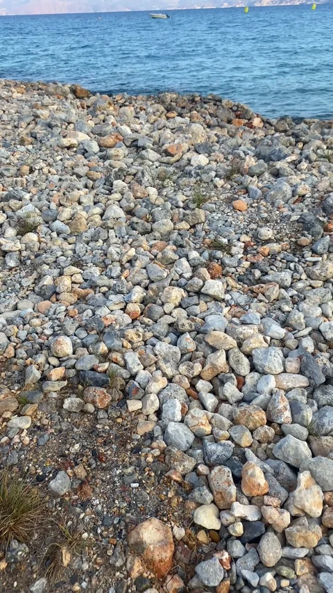 Stone beach. Stones on the beach. Vertical video  Stock Footage 287342003
