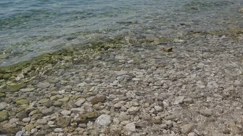 Stone beach with water waves Stock Footage 78910396